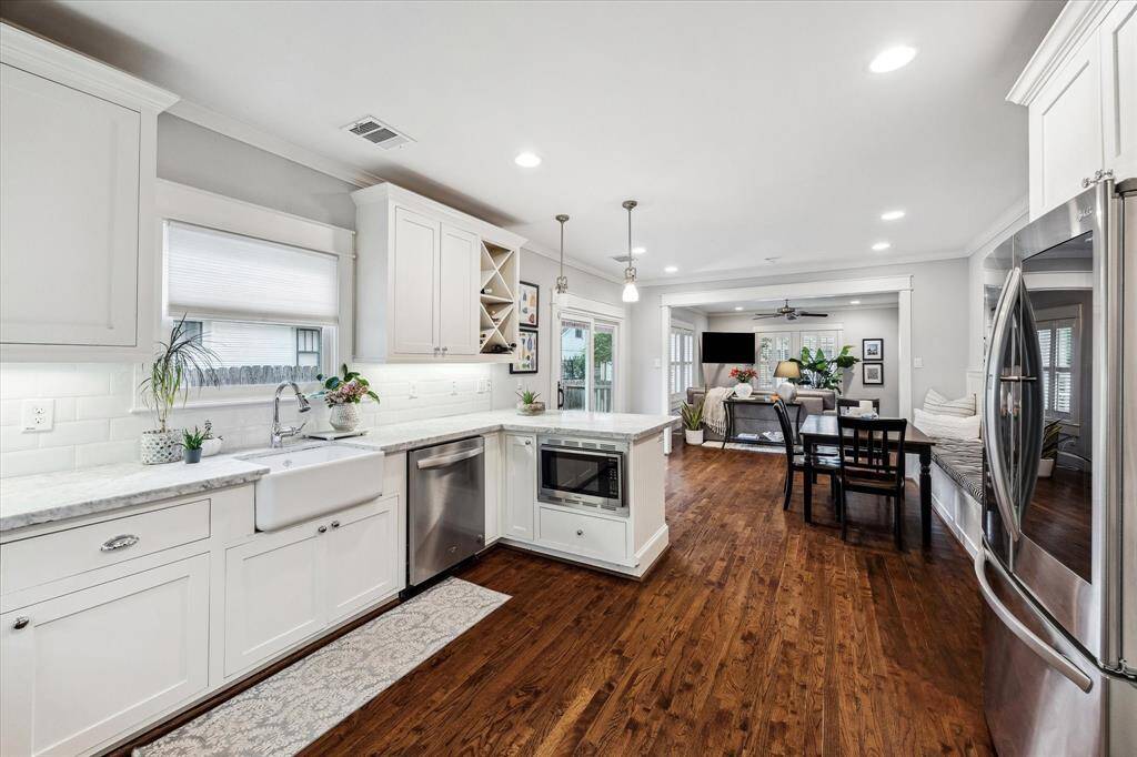 Other highlights of the kitchen is the apron front sink, built-in trash/recycle pull out and wine storage. The open floor plan provides an easy flow for daily life as well as entertaining.