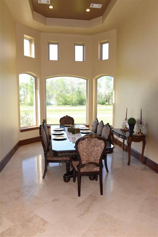 Guest bathroom, granite countertop, and custom travertine flooring.