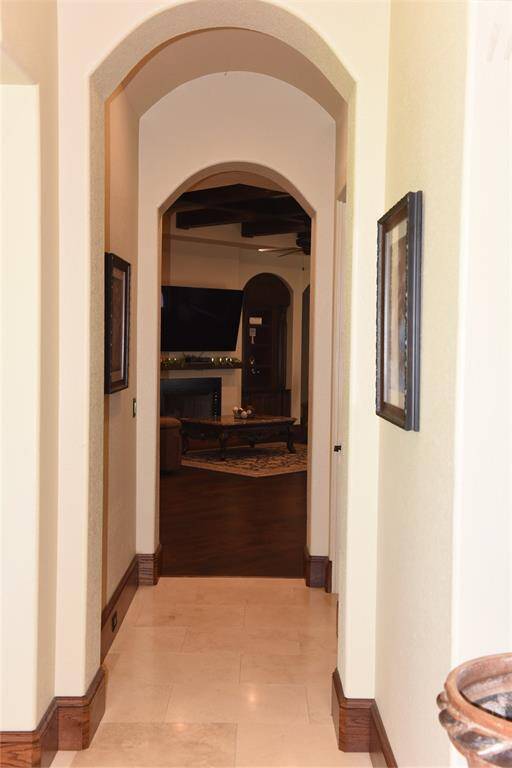 Formal living room/ sitting room, with exquisite ceilings and travertine tile flooring.