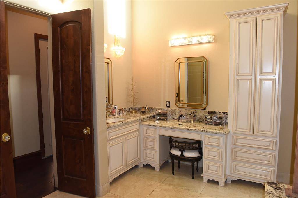 Oversized walk-in shower with wall-to-wall ceramic decorative tile.