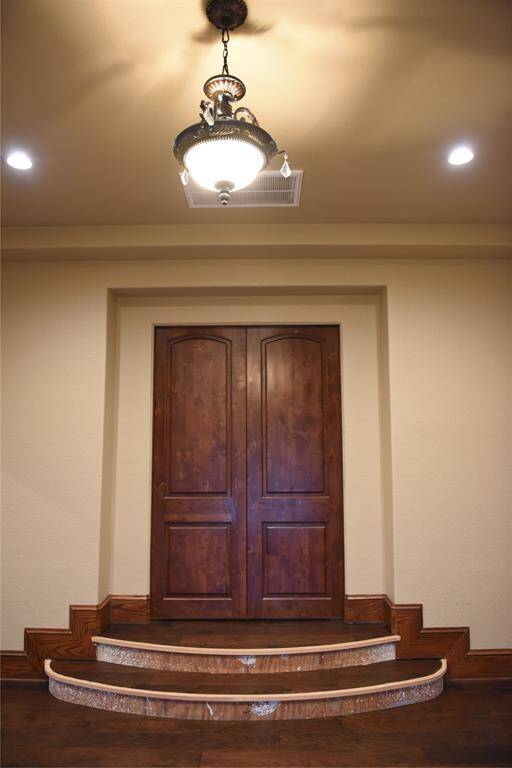 1st guest suite with walk-in closet built in dresser and plenty of storage.
