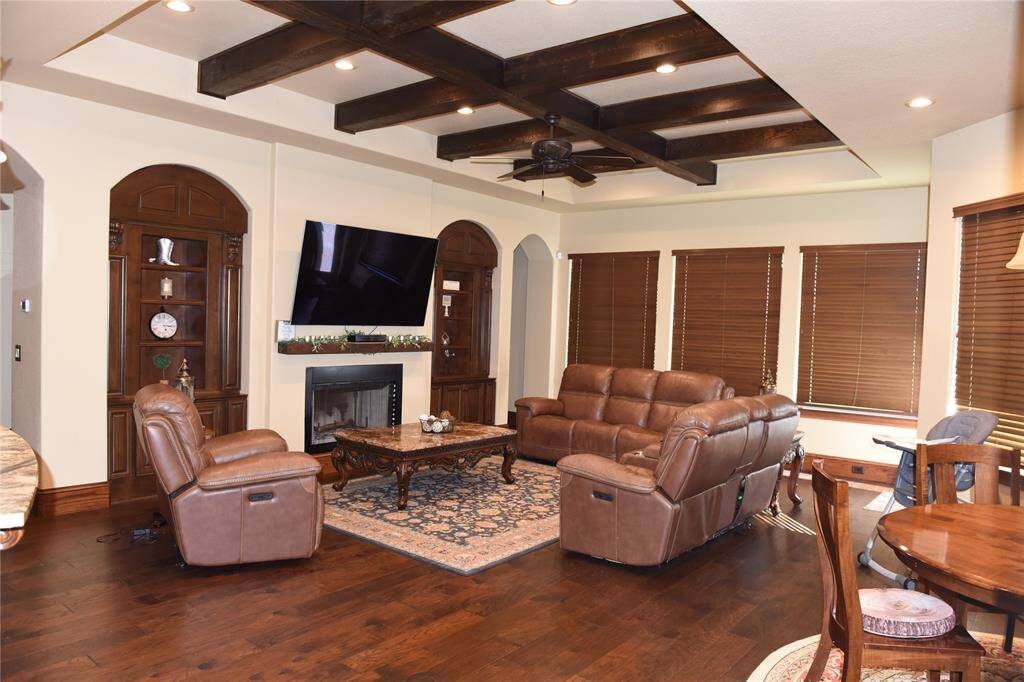 Breakfast area hard wood floors, and custom-built wood blinds.