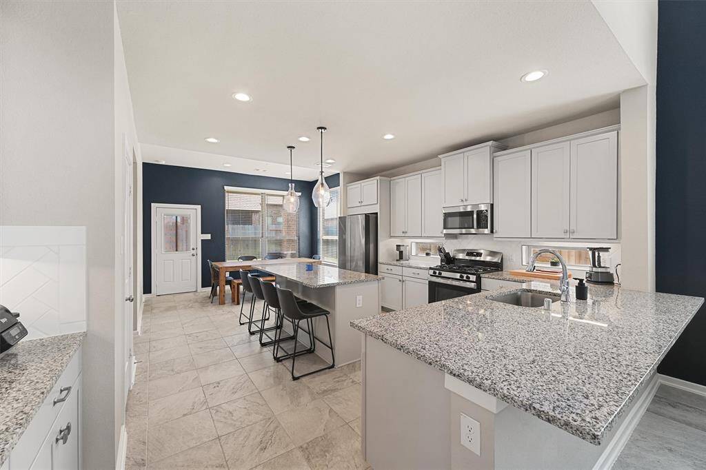 Loved ones can pull up a laptop or worksheet at either of the two counter height bars while the cook makes dinner.