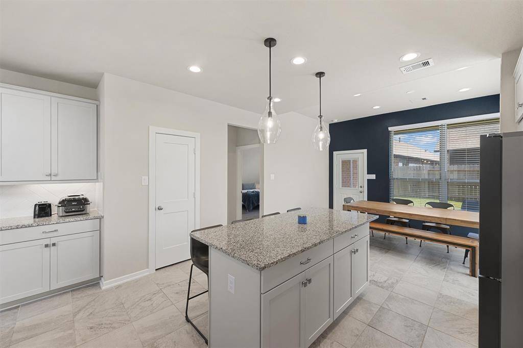 Look at all those kitchen cabinets! Ample space to set up a coffee bar or buffet.