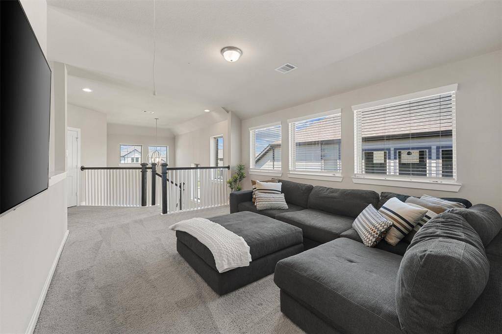 View of the Game Room looking towards the front of the home.
