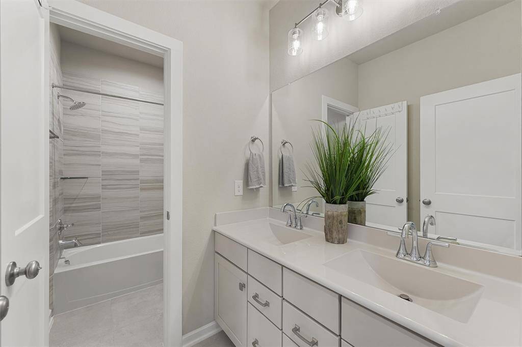 Guests will appreciate the separate vanity area in the bathroom upstairs