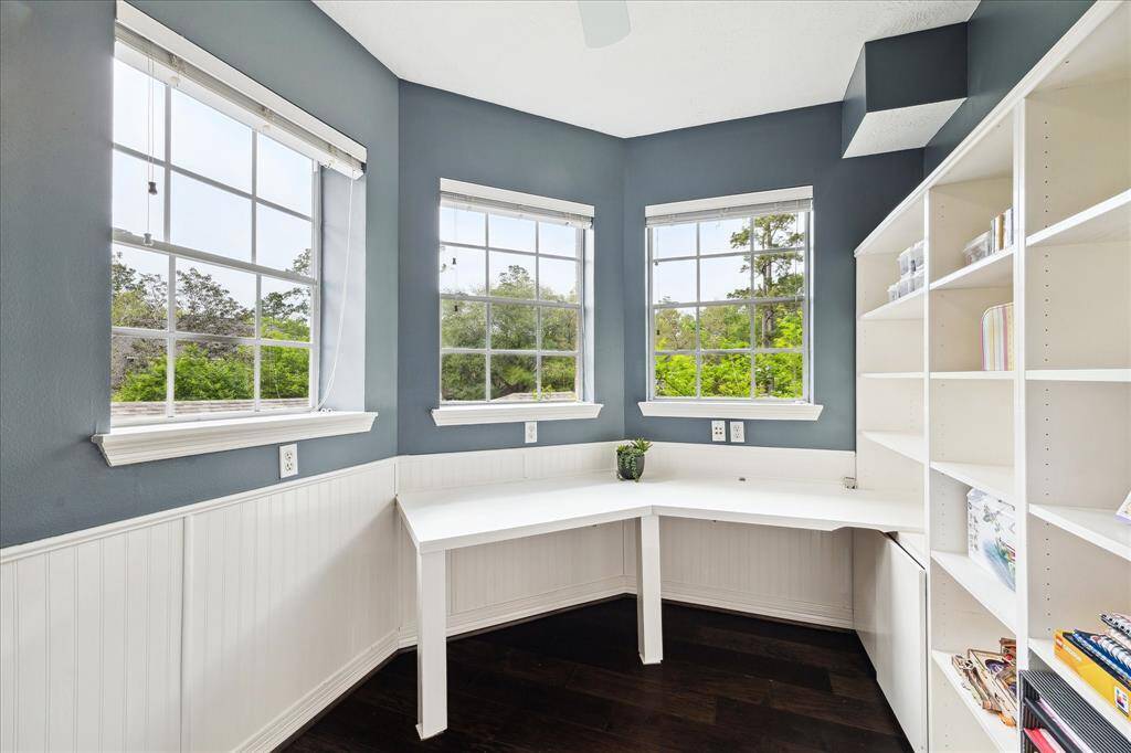 Next to game room is a fun craft/sewing/homework space with built in shelving, desk area and space for organizing all your projects
