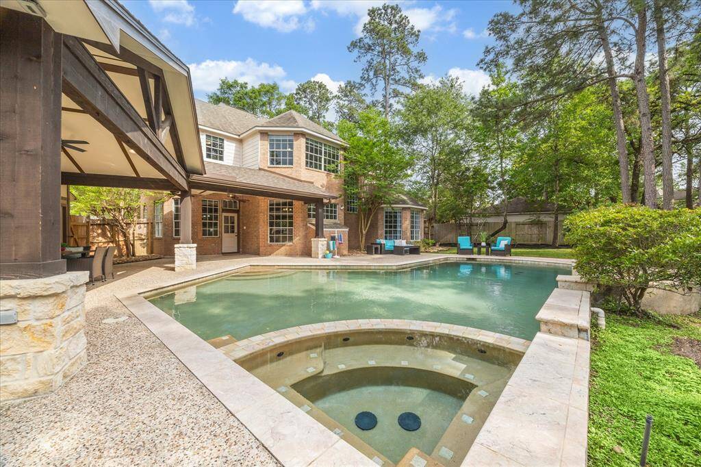 The backyard oasis features a pool/spa