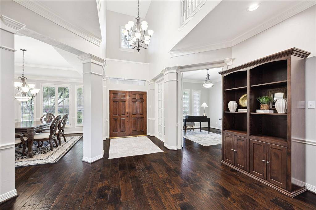 The two-story foyer is a grand welcome to visitors. Upon entering the home will be a formal dining room on one side and then a private enclosed study/library with french doors.