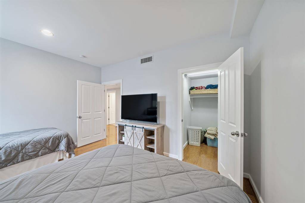A spacious walk-in closet adds both convenience and luxury, providing ample storage for wardrobe essentials and more.