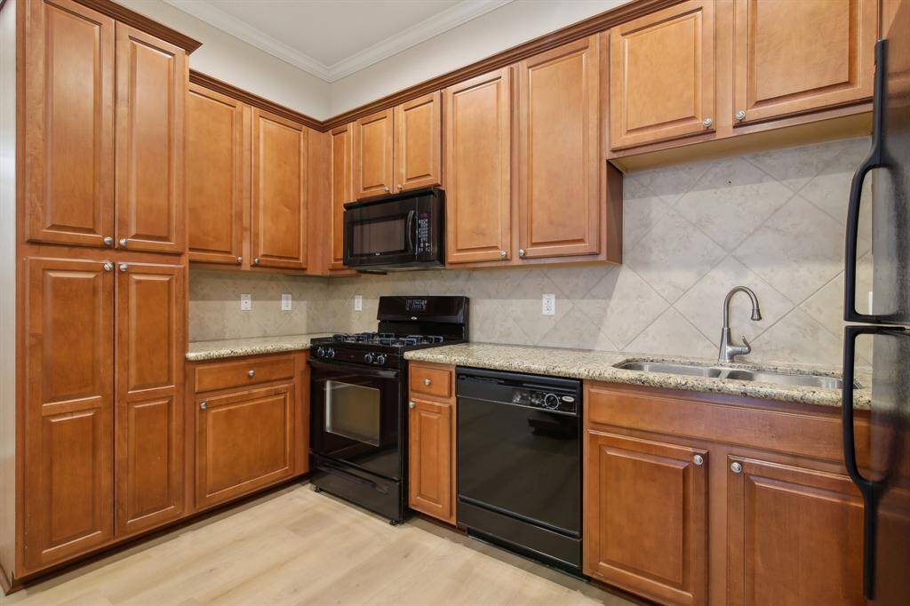 Kitchen features beautiful and recently refinished cabinets