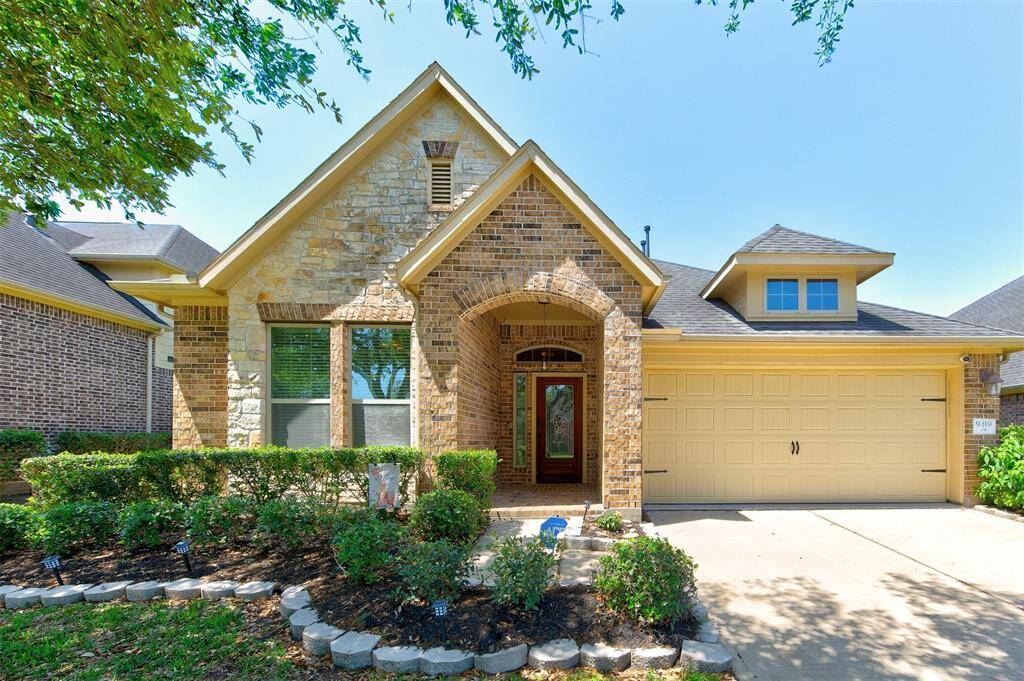 Beautiful & well-maintained home with stone front elevation, brick paver front porch, full yard sprinkler system