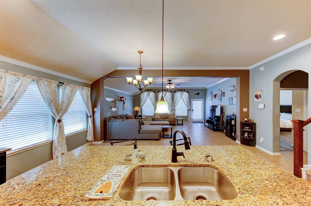 The kitchen is open to the breakfast area & family room