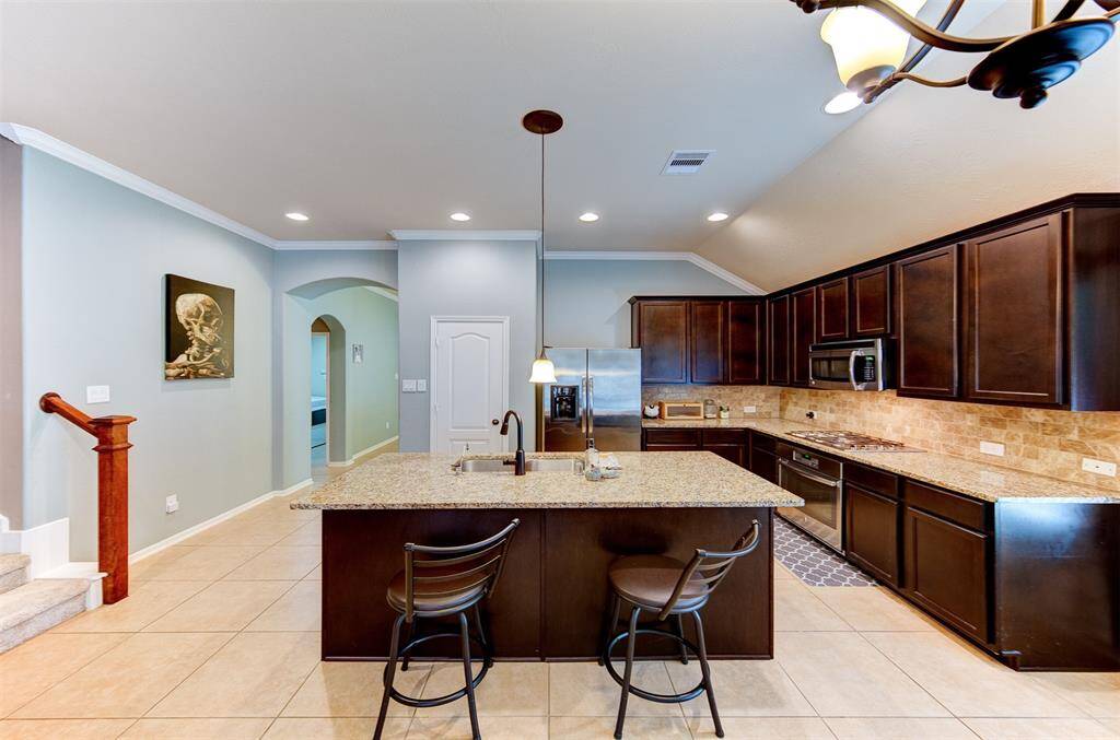 Great view of the kitchen with breakfast bar