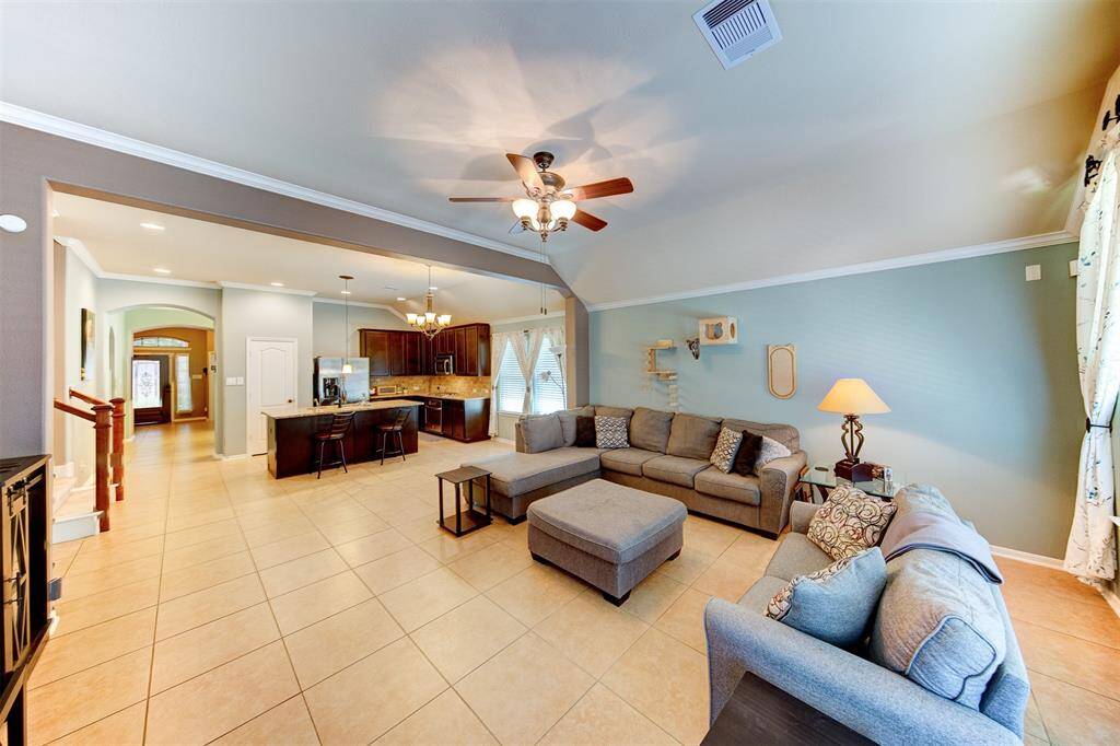 Tile flooring runs from the entry through the formal dining, kitchen, breakfast & family room - easy maintenance