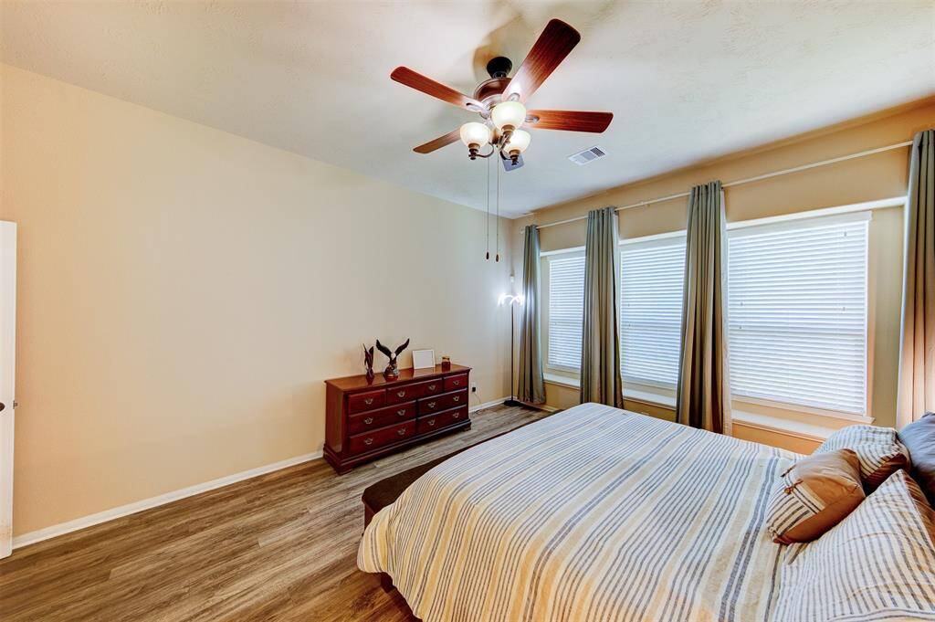 Nice high ceiling with fan - LVP flooring & tile throughout the 1st level