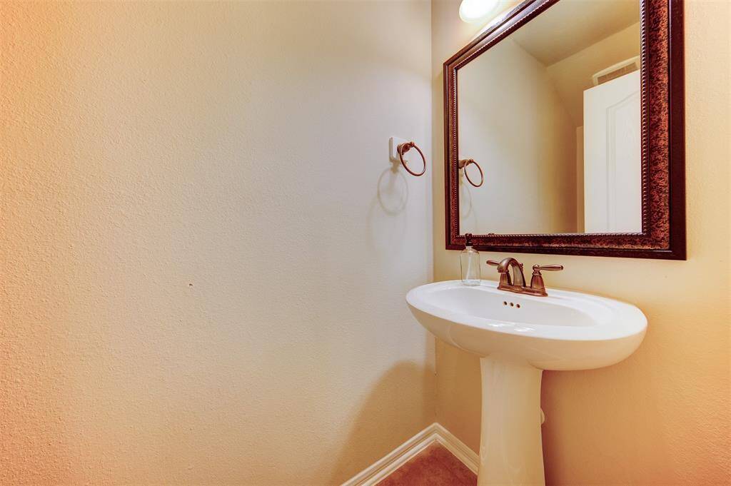Upstairs half bath with pedestal sink