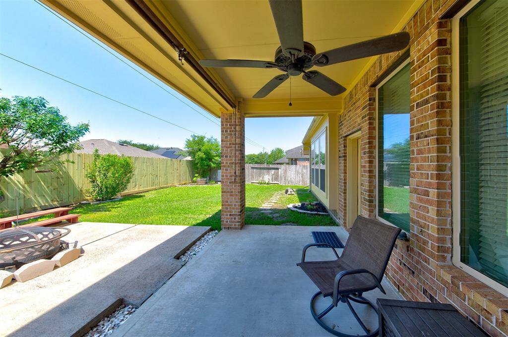 Alternate view of the backyard - plenty of greenspace for kids & pets to play