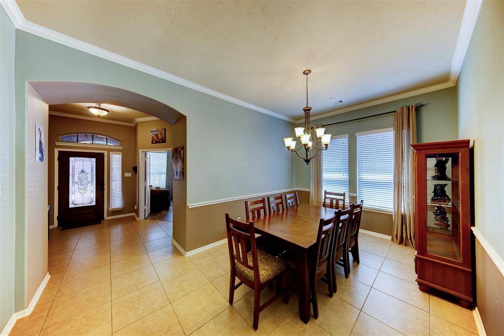 Alternate view of the formal dining toward the entry & study - there is also a powder room for guests next to the study