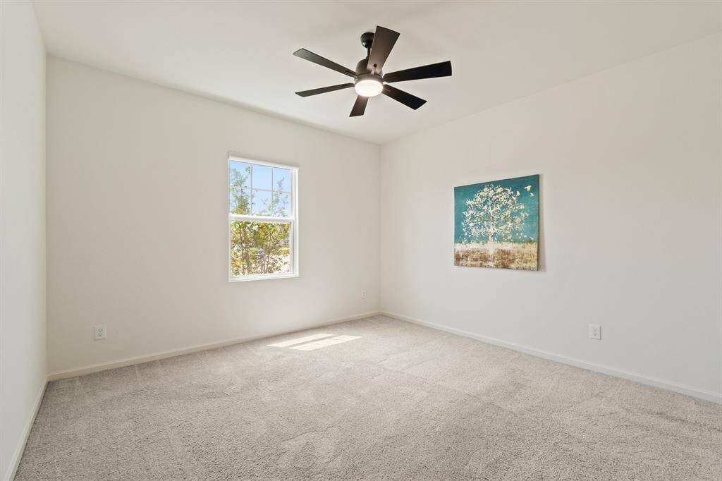 This additional Secondary Bedroom boasts all the same features as the one prior, only this one overlooks the Front Yard. If a second Bedroom is not needed, this space can also function as a Game Room or Study.