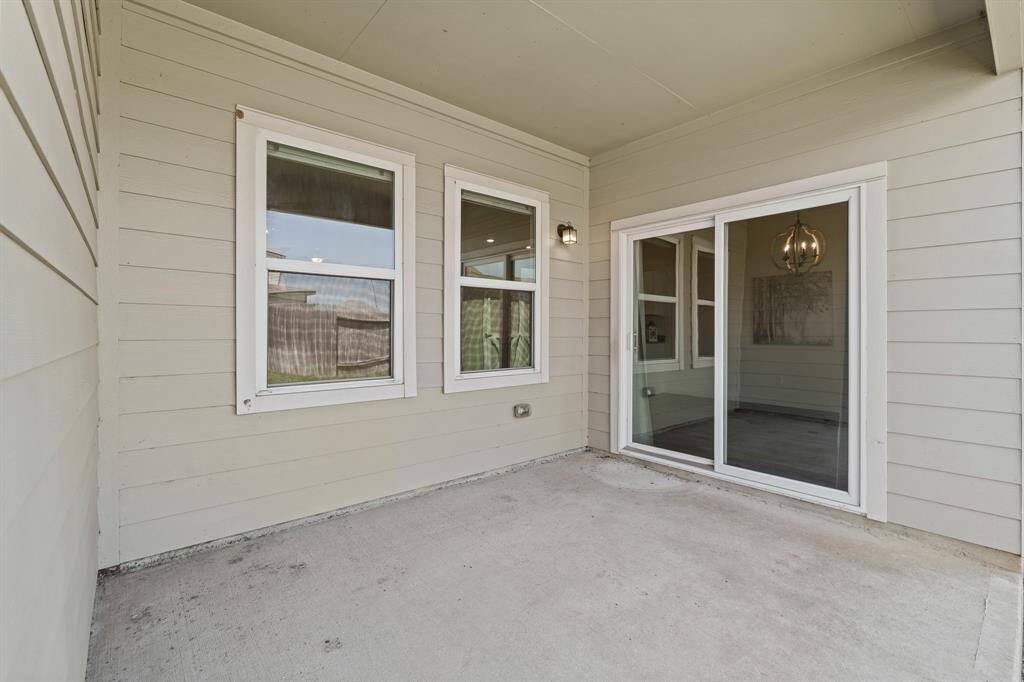 The Back Patio is accessible through the sliding glass door in the Breakfast Room. This Patio is the perfect place to unwind after a long day, grill burgers, and enjoy a cold and refreshing glass of tea.