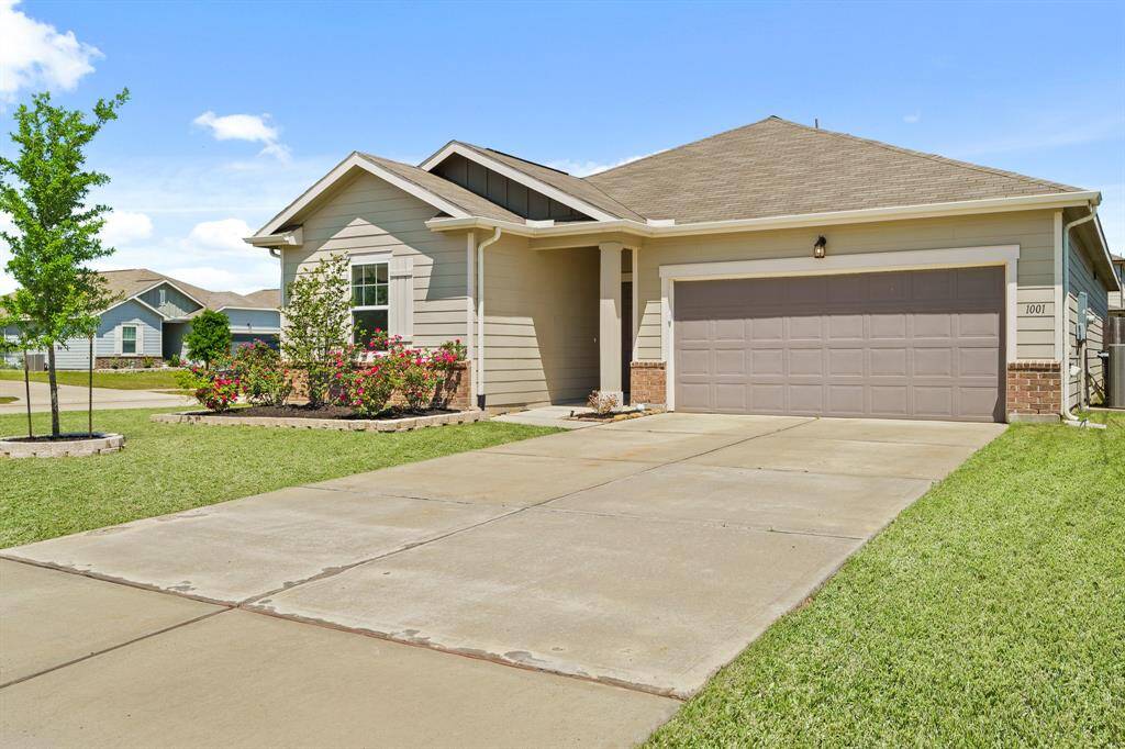 This oversized driveway leads to the home’s 2-Car Garage. A centralized carriage light illuminates the space.