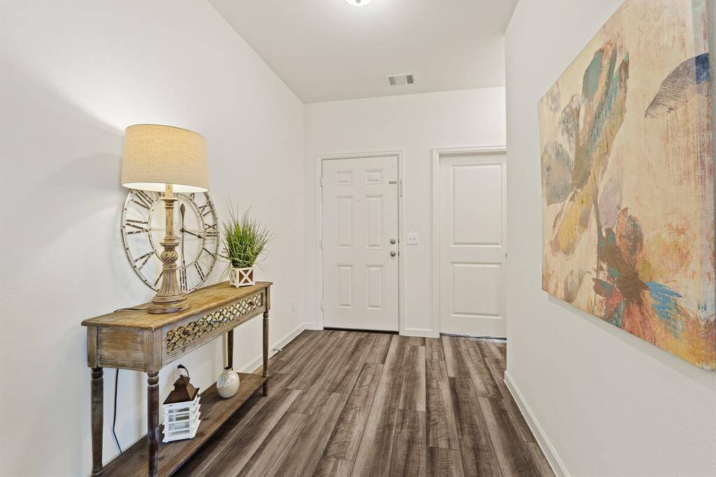 This look back towards the front doors highlights just how open and spacious this Foyer truly is. The space can easily accommodate a bench, coat rack, or storage piece.