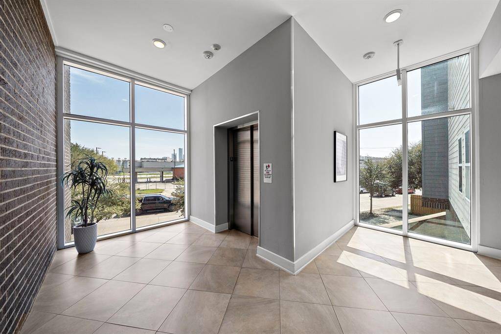 Welcoming first-floor elevator lobby.