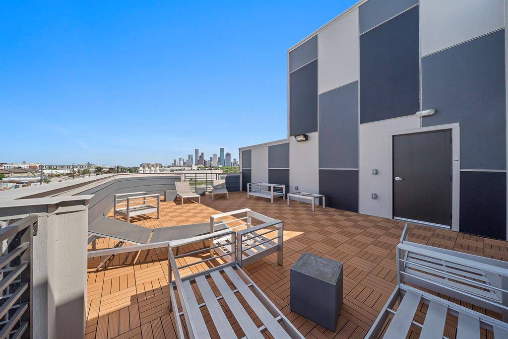 Stunning rooftop deck with panoramic city views—perfect for relaxing or entertaining.