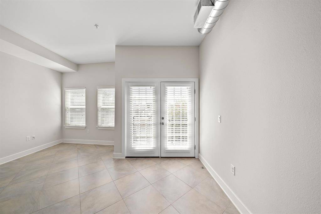 This light-filled dining and living area offers a warm, inviting space perfect for gatherings and everyday comfort.