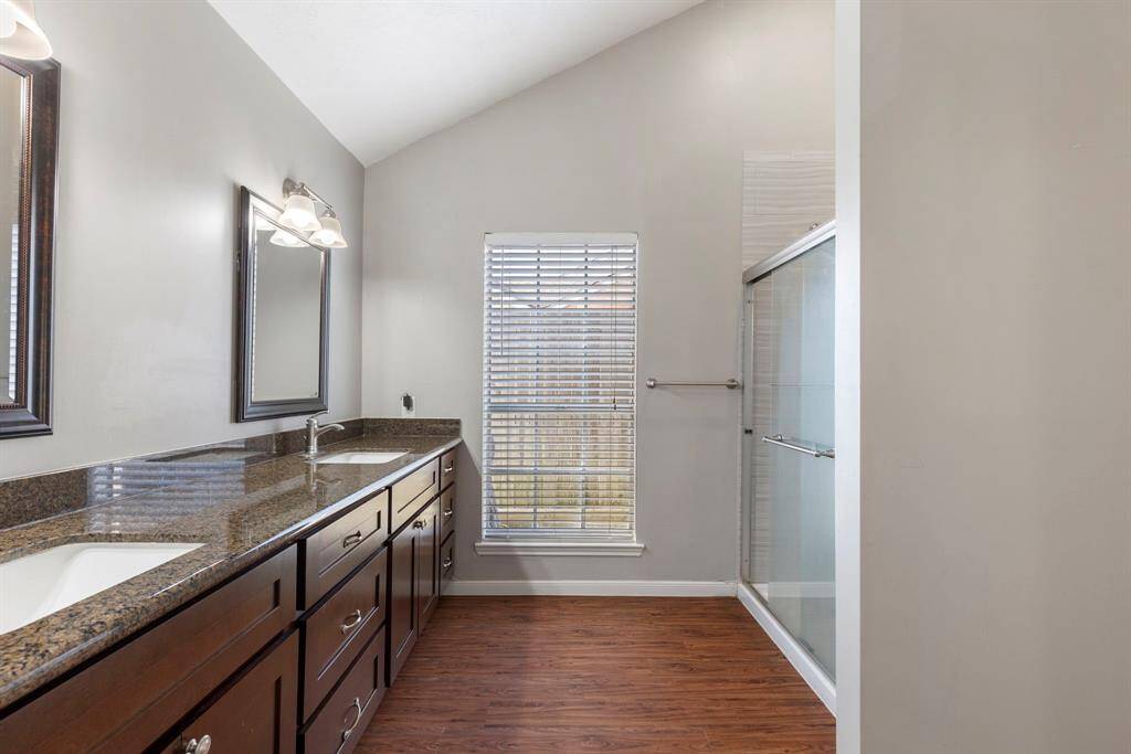 Here is a view of the primary bath with very nice cabinets and dual sinks.