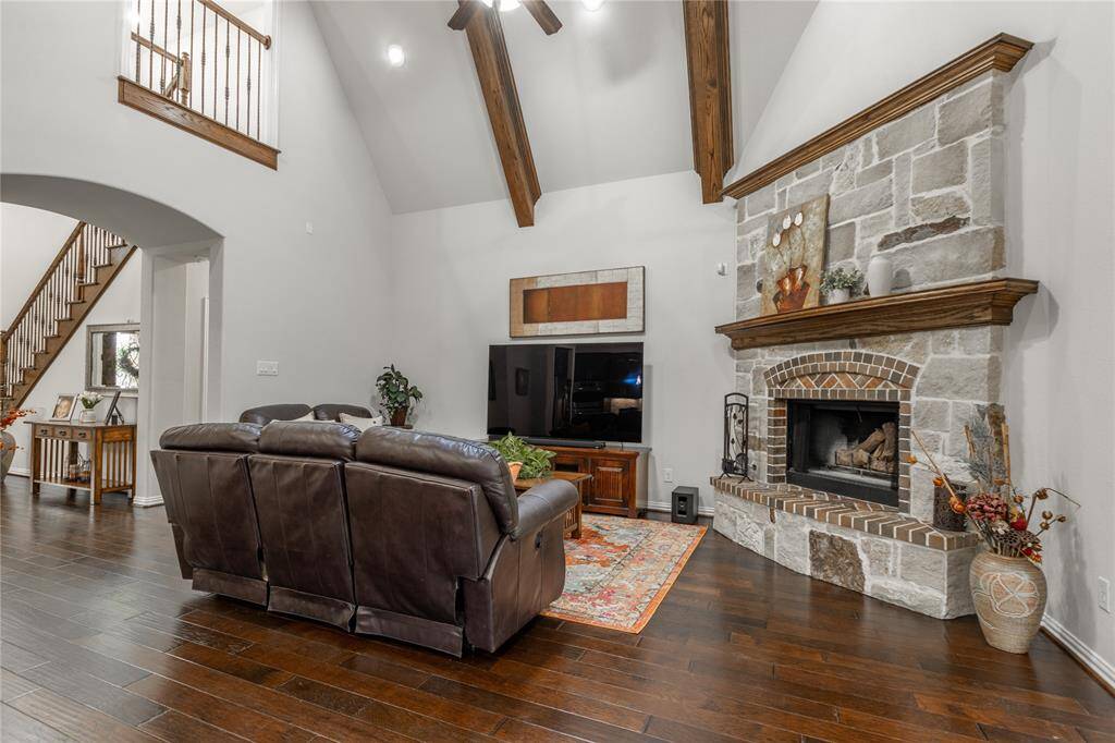 Family room with upgraded beams and gas fireplace.