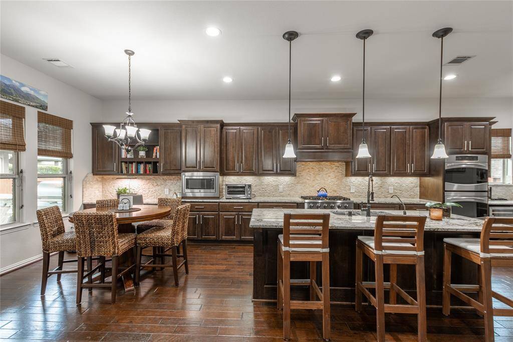 Tons of cabinets, double ovens and upgraded cooktop for the chef in the family!