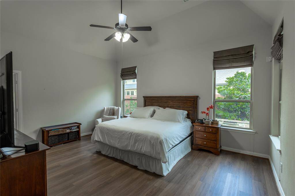 Large primary room with pool view.