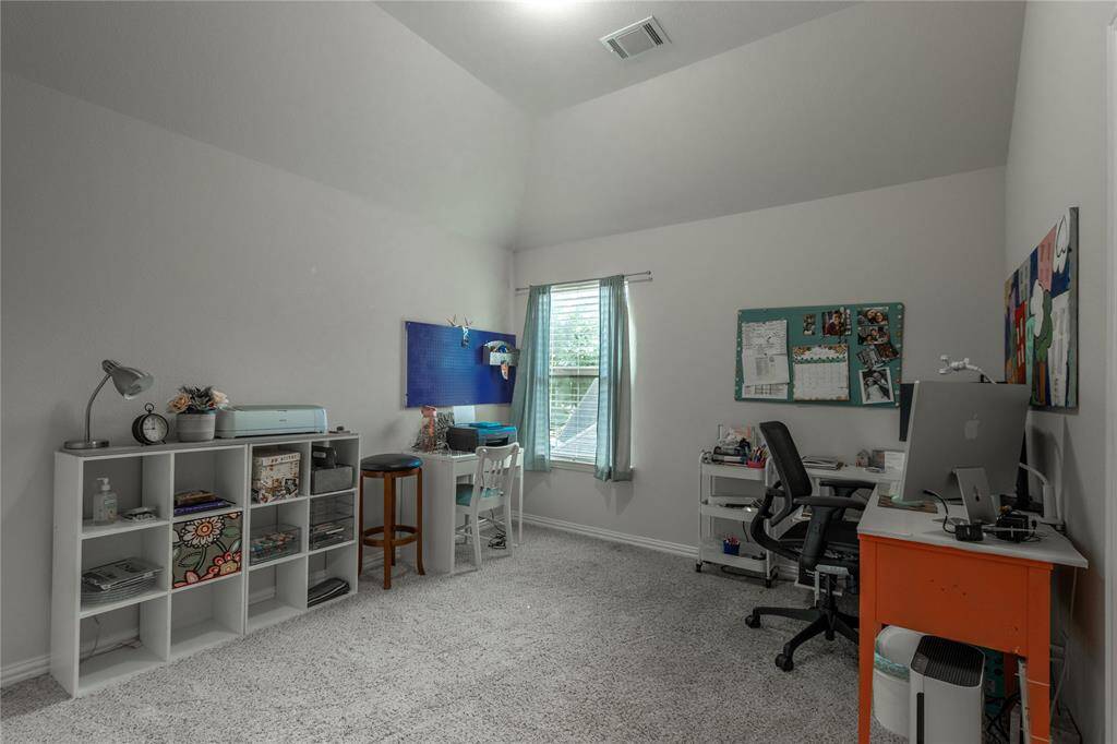 Another secondary bedroom upstairs used as a craft room.