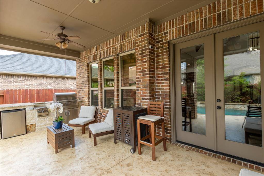 Covered patio with outdoor kitchen.