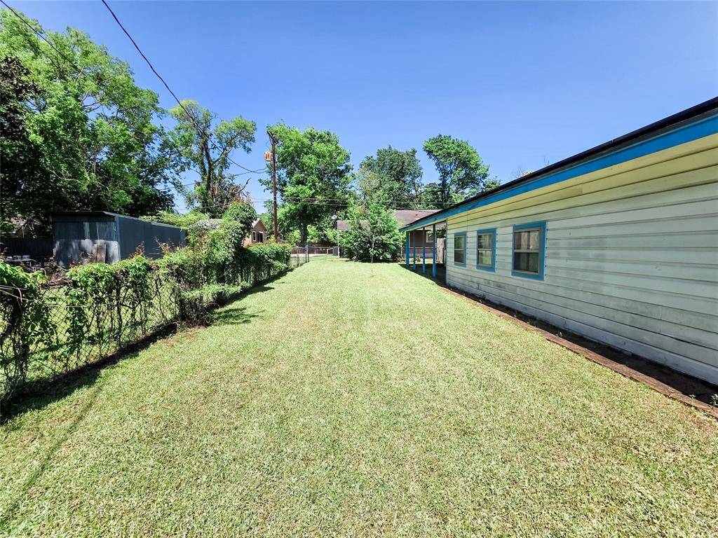 This oversized backyard offers endless possibilities—add a garden, build a workshop, or create your dream outdoor living space.