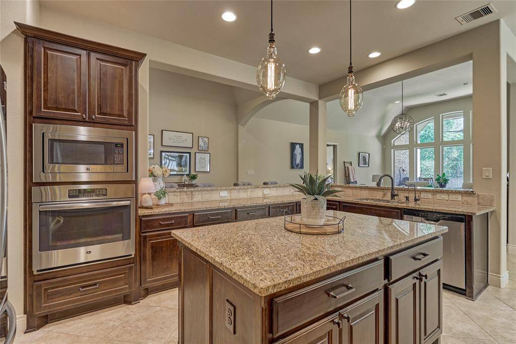 The wall-mounted oven and microwave simplify tasks in the kitchen.