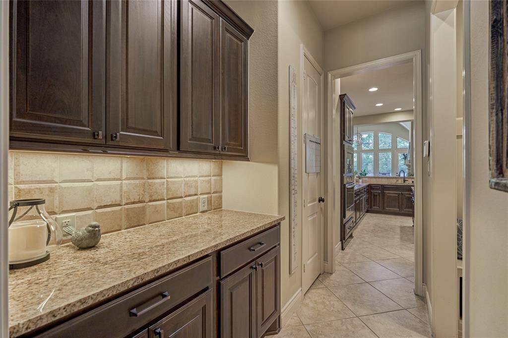 The butler's pantry links the kitchen to the dining room and features undercounter lighting.