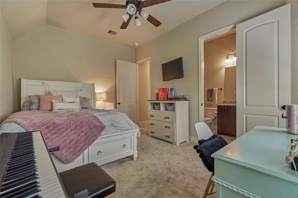 The additional primary bedroom and bathroom are ideal for accommodating guests.