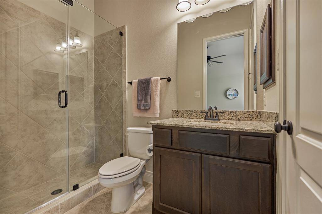 The bathroom of the second primary with a closet to the right of the sink.