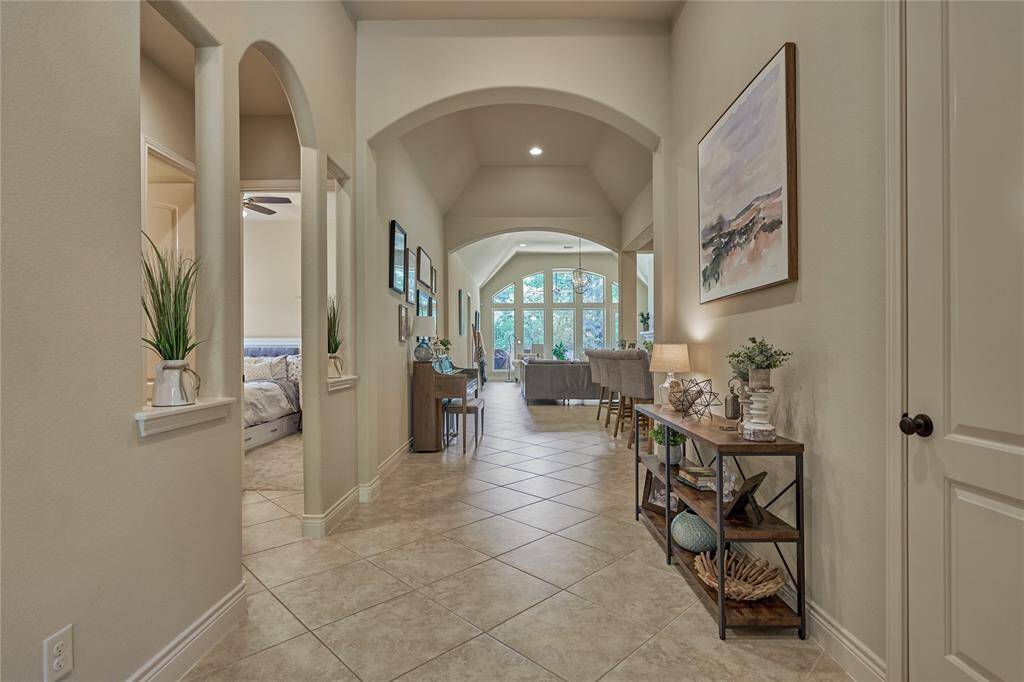 To the left, you'll find the entrance leading to two of the secondary bedrooms, with a bathroom between them.