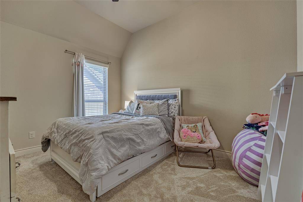 One of the secondary bedrooms with a walk-in closet which shares a full bathroom.