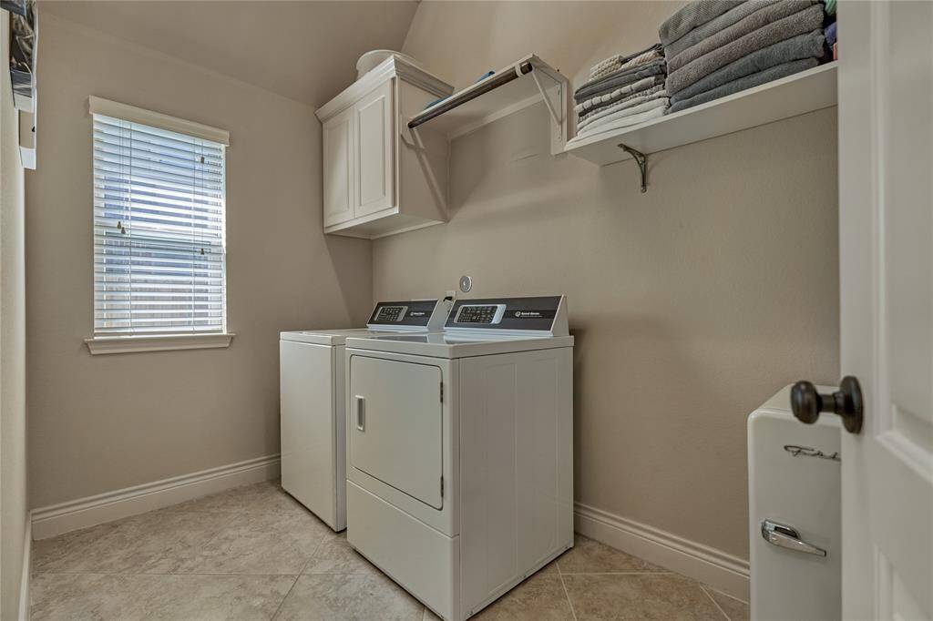 The large laundry room can accommodate an additional refrigerator.