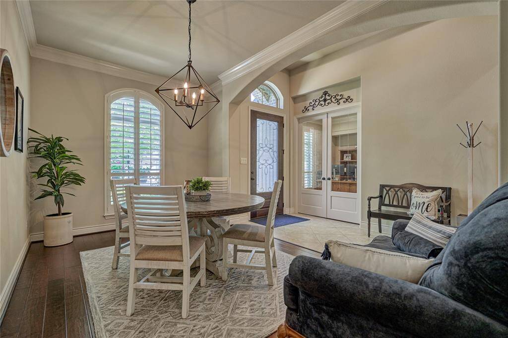 The spacious dining room opens to the foyer with engineered hardwood flooring and a butler's pantry that connects to the kitchen.