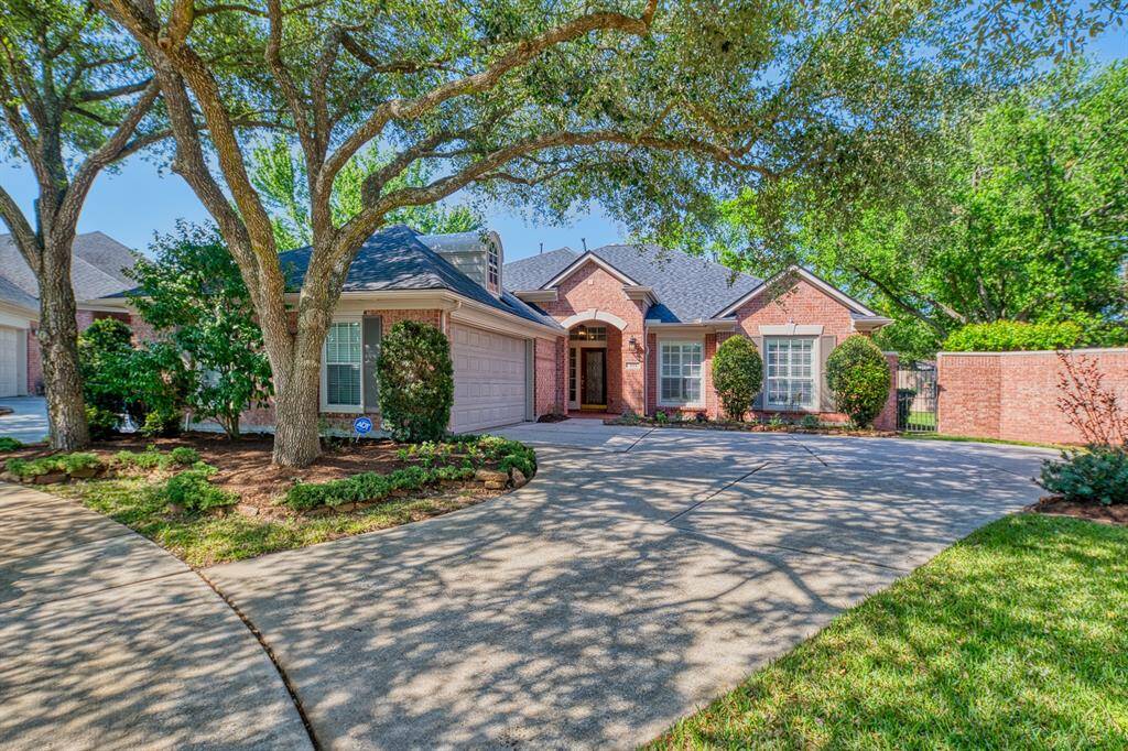 The home, located in a small, gated community, has such wonderful curb appeal with its towering Oak trees and mature landscaping! The lot is exceptional too, with room for a pool and more.