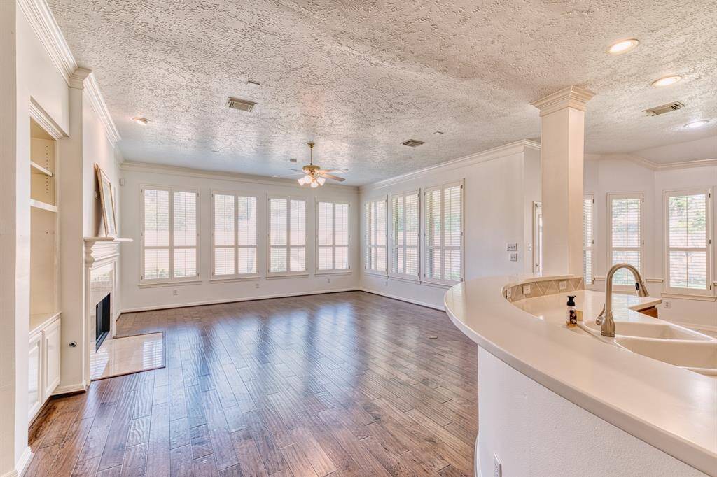 One of the unique features of The Laurel Valley plan (Village Builders) is this very long, curved counter/bar, great for sitting guests while the cook is in the kitchen.
