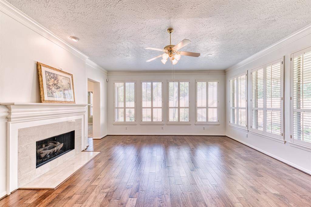 Gas Log fireplace for those chilly winter nights (And Houston does have a few). All of these windows provide an abundance of natural light and a great view of the backyard.