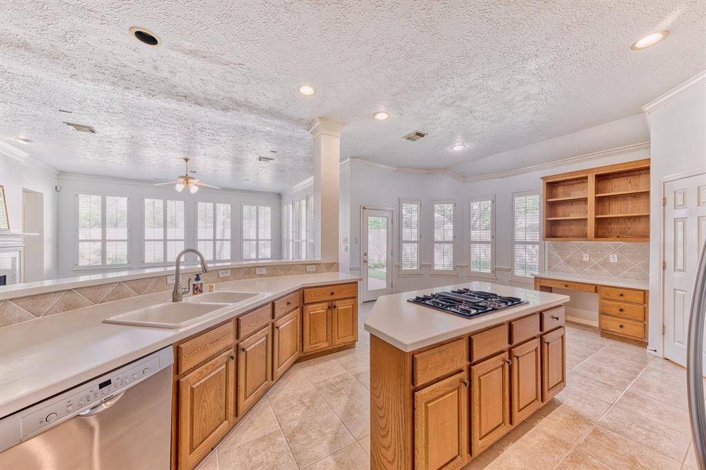 Kitchen island with a gas cooktop.