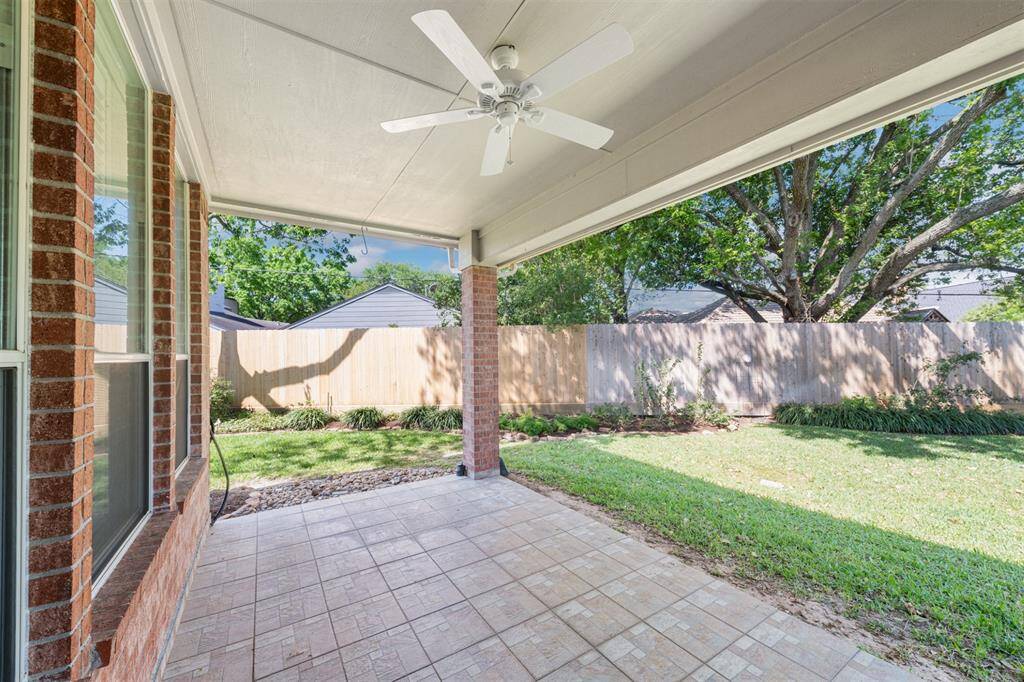 Enjoy the views of your garden from this large, tiled covered patio which extends the indoor space to the outside! This space is ideal for entertaining or just relaxing!